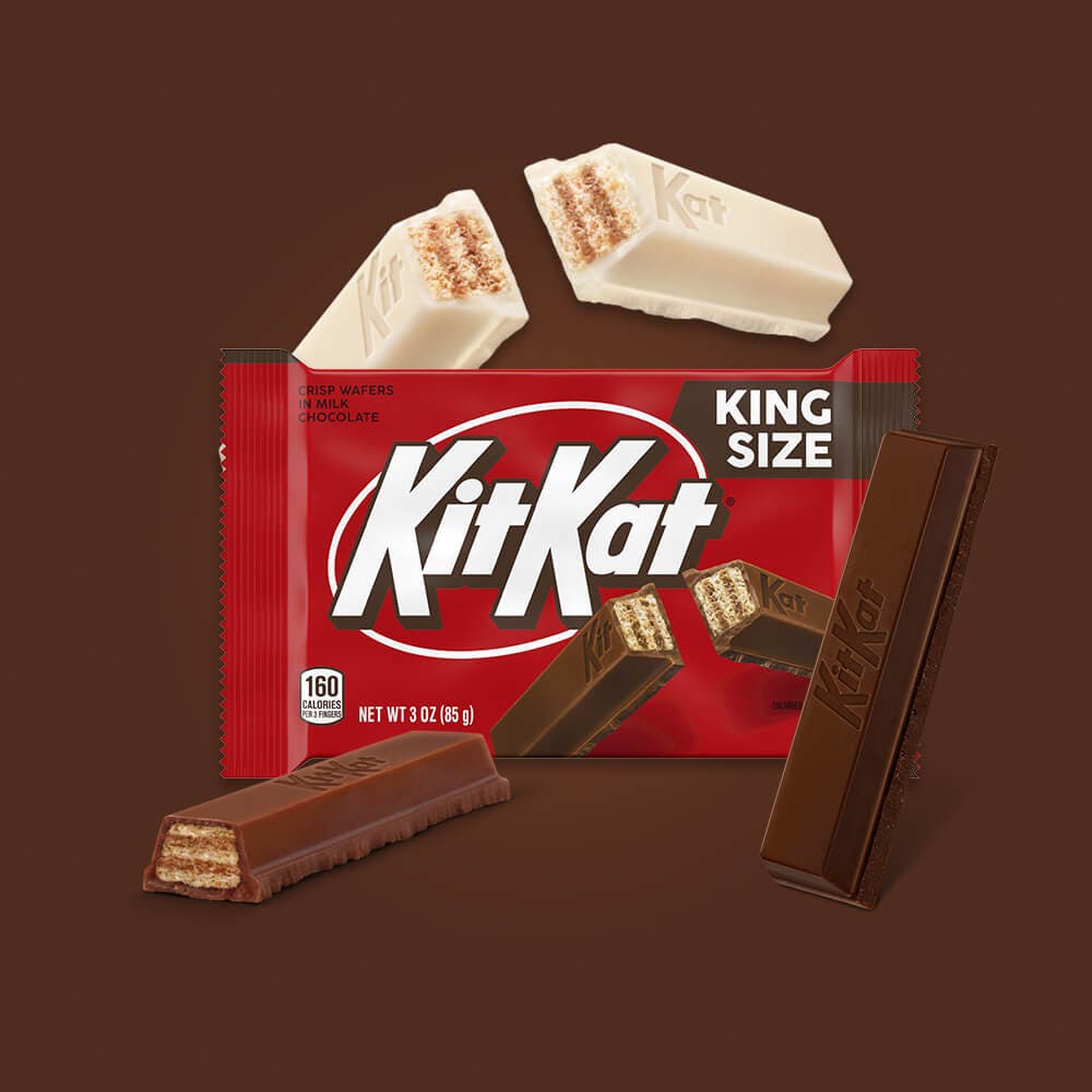 unwrapped kit kat king size bars in vanilla, milk chocolate, and dark chocolate variations